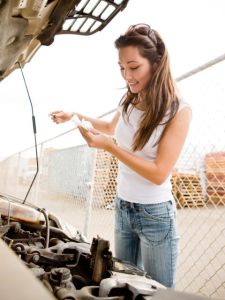 woman-checking-oil-in-car