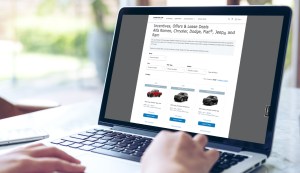 First-time car buyer looking at vehicle offers on a computer